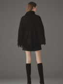 ケーブルニットポンチョ