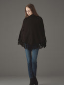 ケーブルニットポンチョ